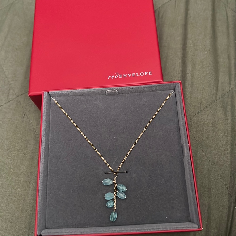 blue crystals on a gold chain
